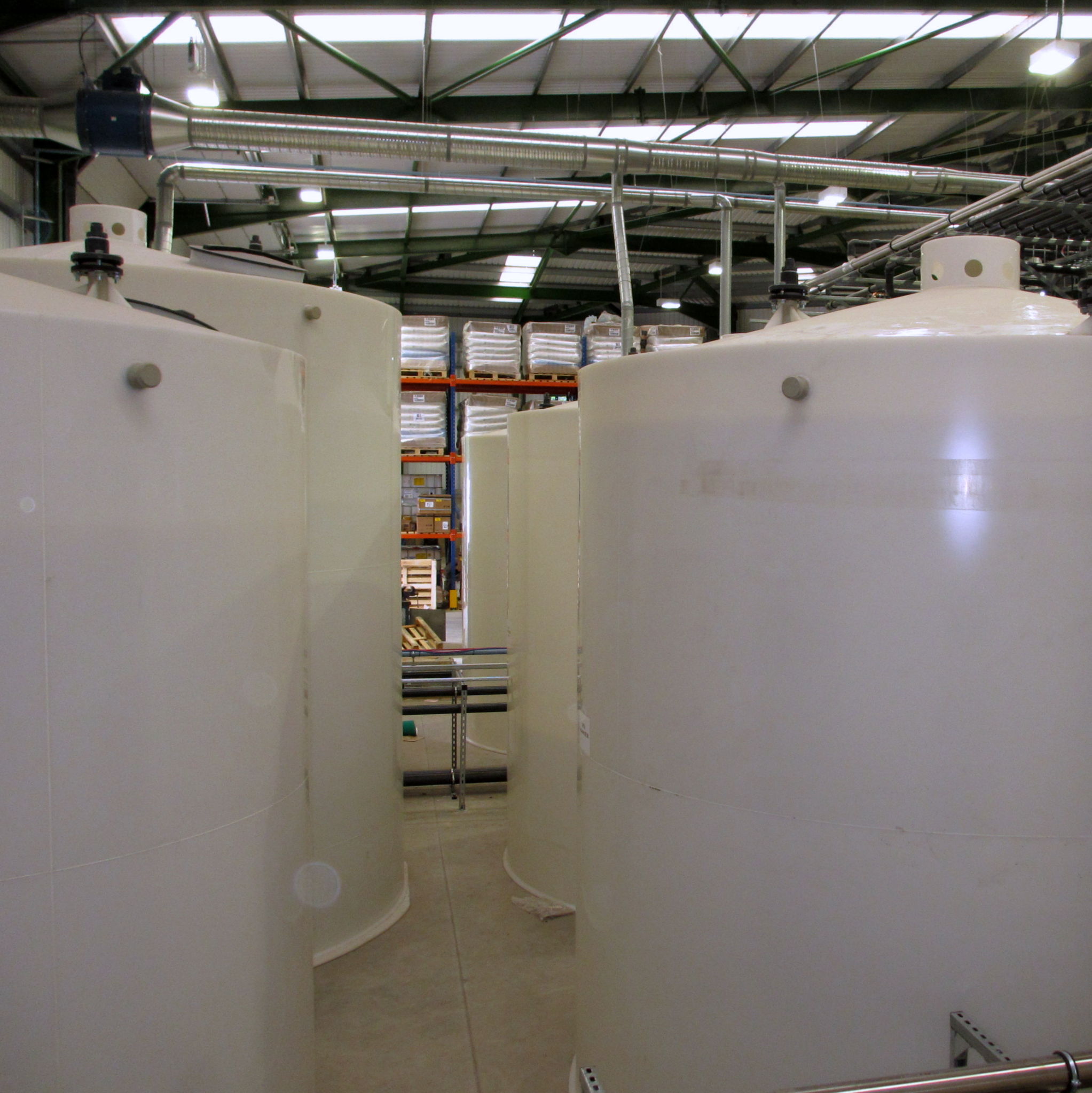 Large Plastic Storage Tanks & Cylinders for Storage of Various Liquids with Sloped and Conical Bottoms